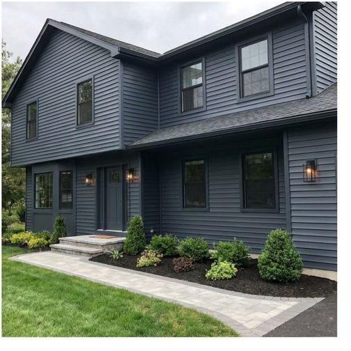 Home exterior freshly painted in deep navy by ISL Construction